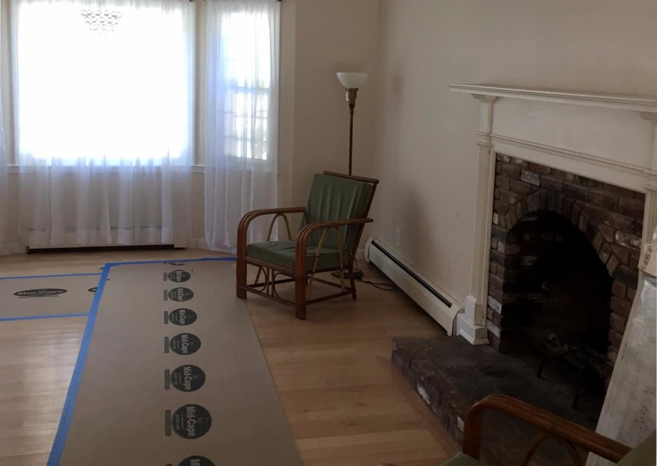36 General Lawrence Road South Yarmouth, MA 02664 - Photo 9 of 14 a living room with furniture and a fireplace