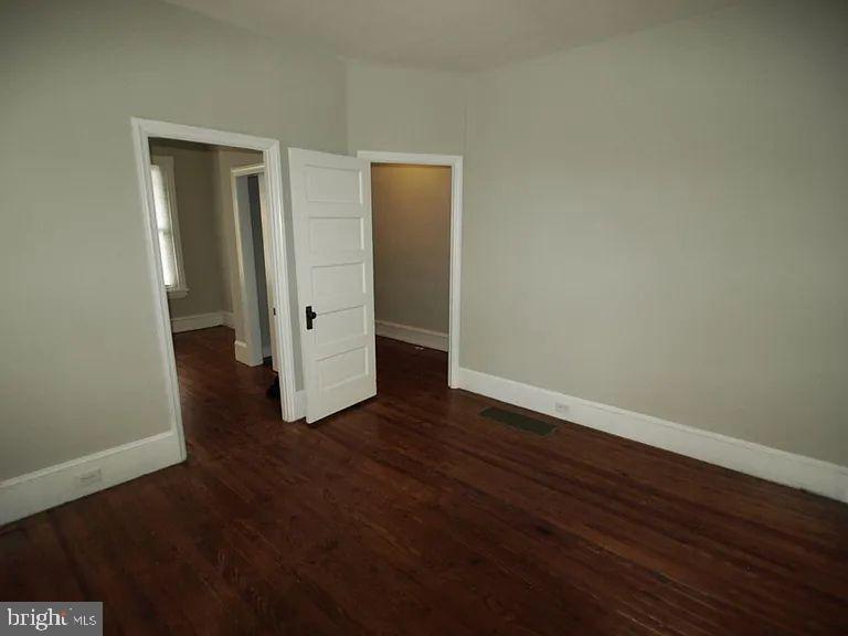 4335 Fleming Street Philadelphia, PA 19128 - Photo 11 of 19 a view of an empty room with wooden floor and closet