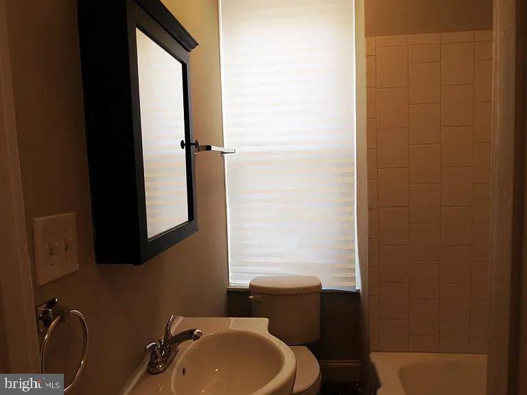 4335 Fleming Street Philadelphia, PA 19128 - Photo 14 of 19 a bathroom with a sink toilet and shower