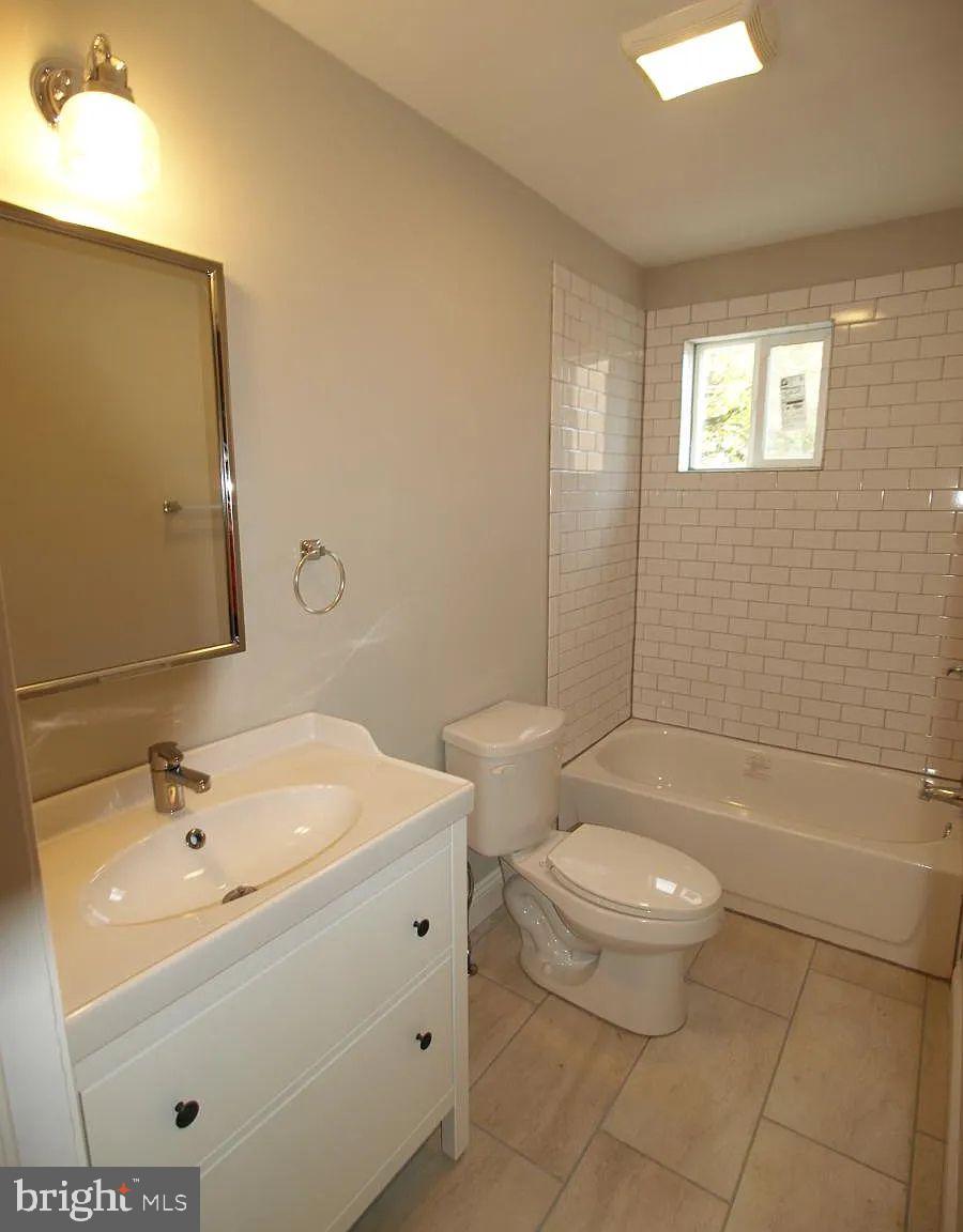 4335 Fleming Street Philadelphia, PA 19128 - Photo 15 of 19 a bathroom with a sink a toilet and bathtub