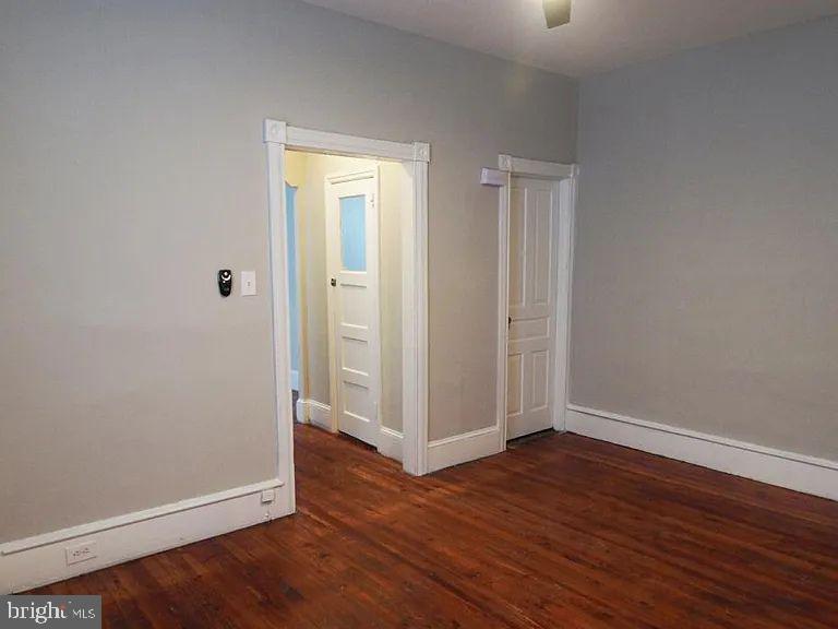 4335 Fleming Street Philadelphia, PA 19128 - Photo 6 of 19 an empty room with wooden floor and entrance