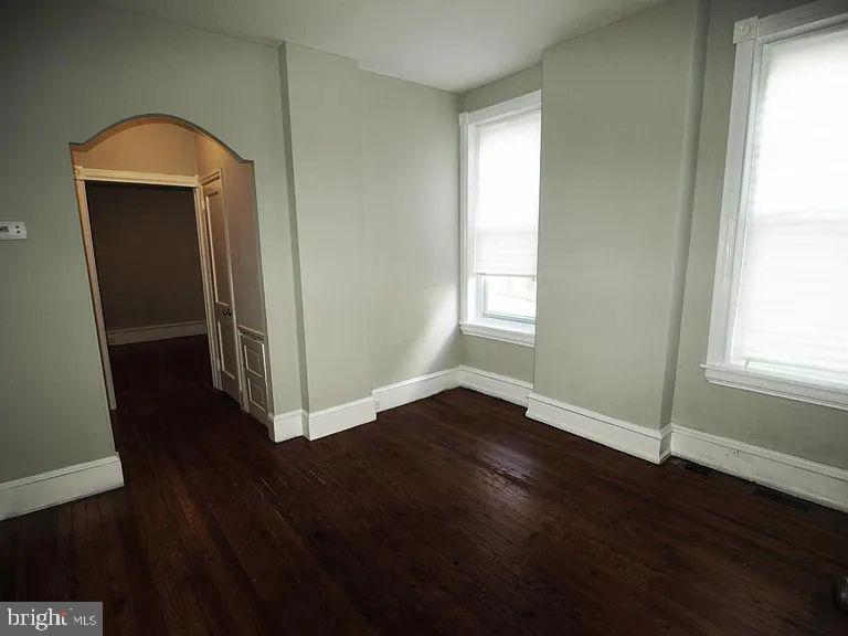 4335 Fleming Street Philadelphia, PA 19128 - Photo 10 of 19 an empty room with wooden floor and windows
