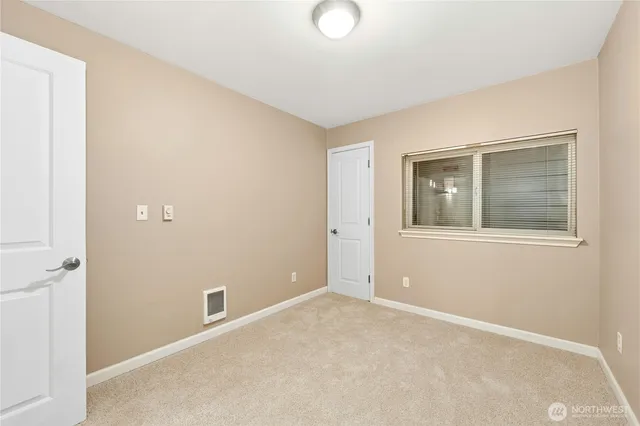 a bathroom with a granite countertop sink toilet a mirror and shower
