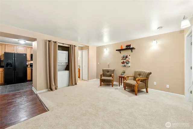 a view of a livingroom with furniture and a flat screen tv