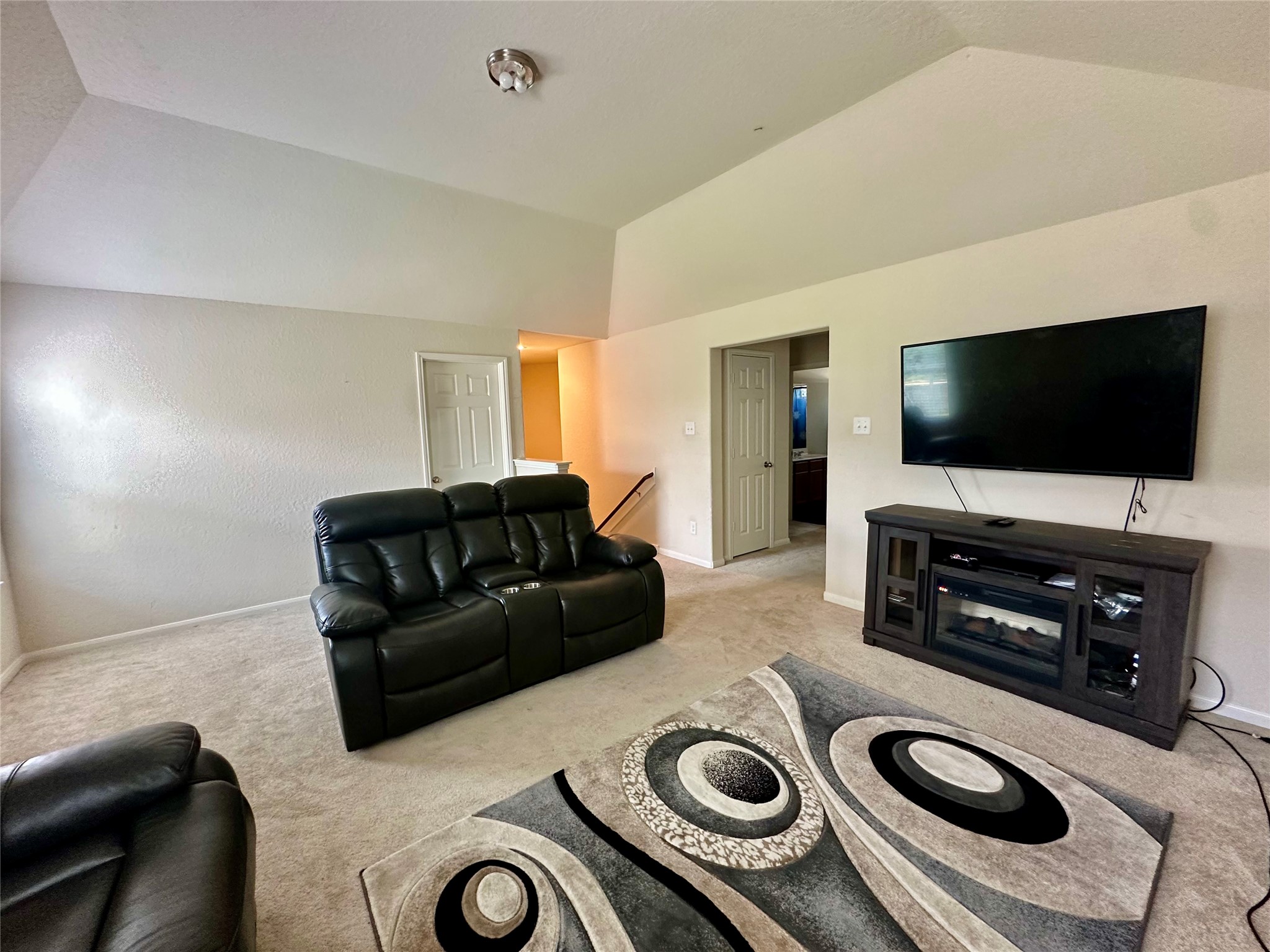 18622 Each Elm Way Houston, TX 77084 - Photo 25 of 35 a living room with furniture and a flat screen tv