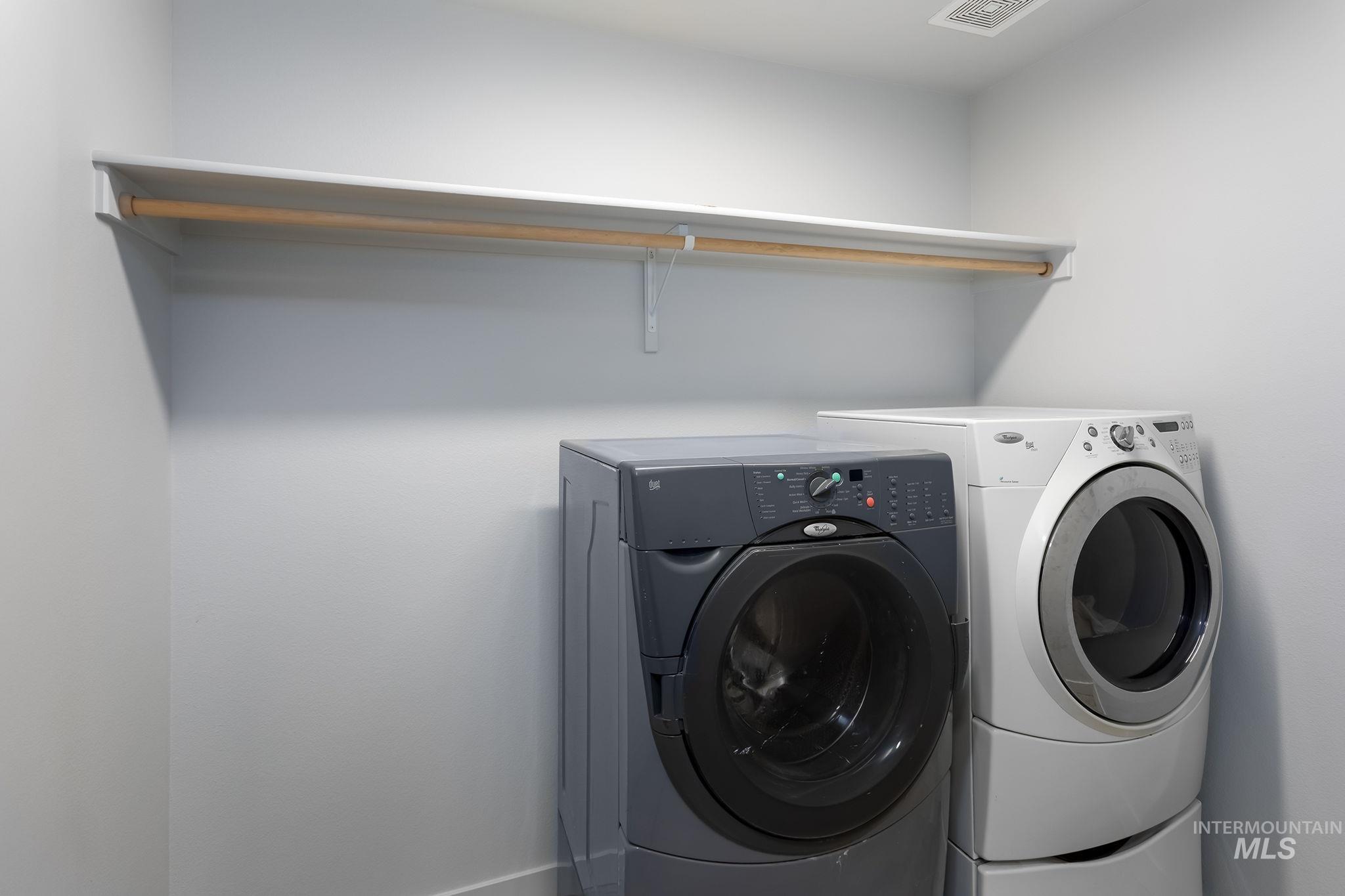 12771 Carkhill Street Caldwell, ID 83607 - Photo 12 of 13 Dedicated laundry area featuring a wall-mounted shelf and clothes rod