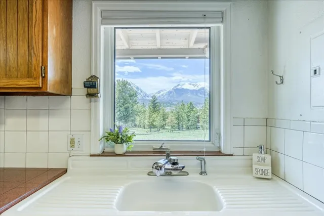 a white bath tub sitting next to a window