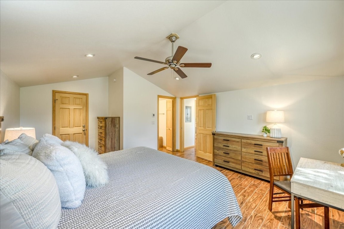 38 D Road Silverthorne, CO 80498 - Photo 17 of 34 a bedroom with a bed a ceiling fan and a dresser
