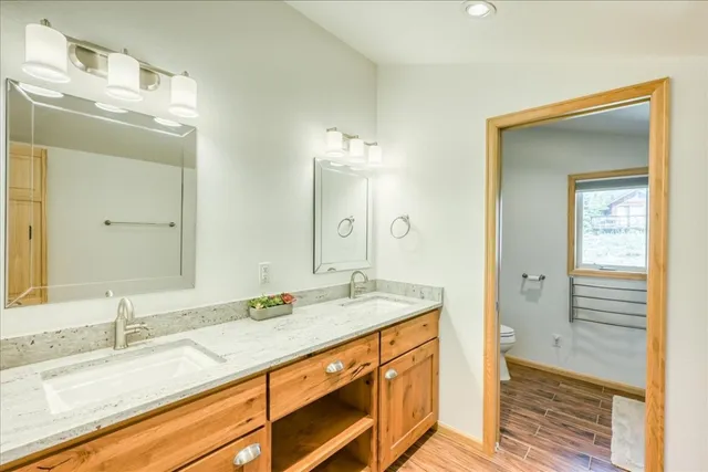 a bathroom with a sink double vanity and a mirror