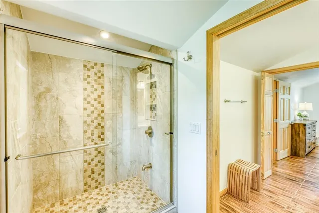 a bathroom with a shower and a tub