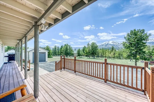 a view of a patio with wooden floor
