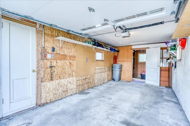 a view of empty room with wooden walls
