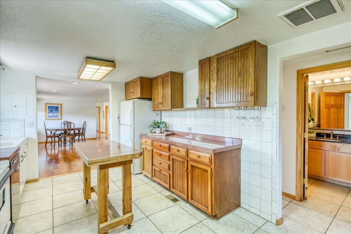 38 D Road Silverthorne, CO 80498 - Photo 10 of 34 a kitchen with stainless steel appliances granite countertop a stove and cabinets