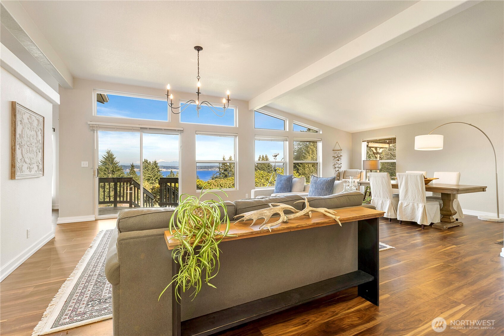 3834 South Passage View Lane Langley, WA 98260 - Photo 11 of 40 a view of a dining room with furniture window and wooden floor