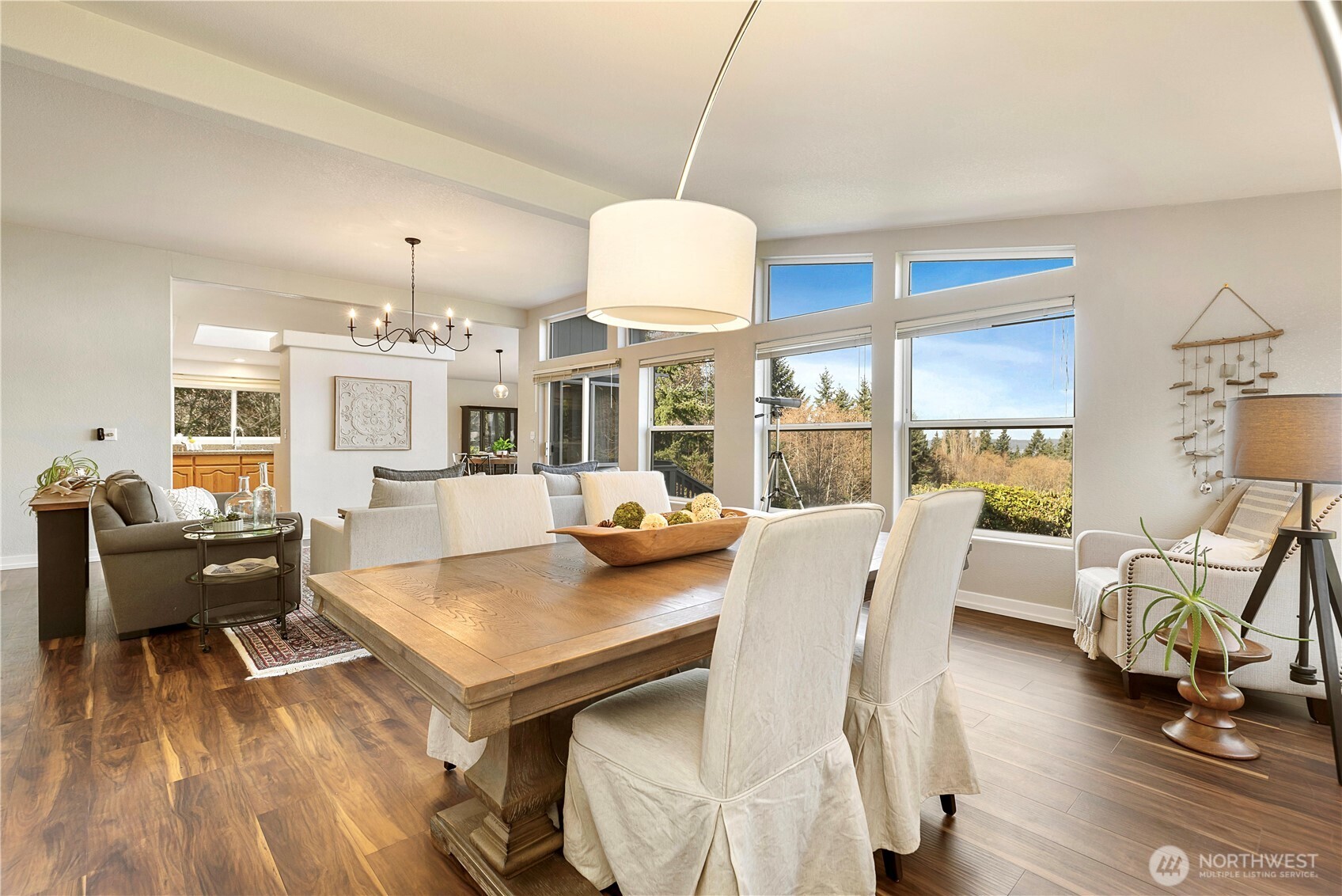 3834 South Passage View Lane Langley, WA 98260 - Photo 13 of 40 a view of a dining room with furniture window and wooden floor
