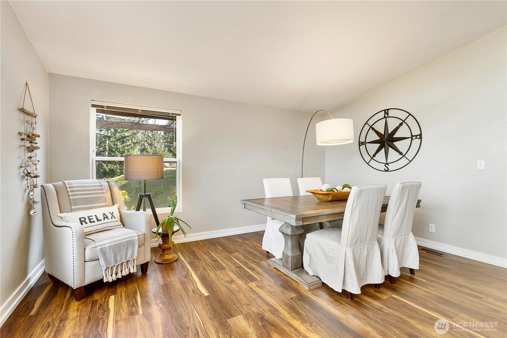 3834 South Passage View Lane Langley, WA 98260 - Photo 14 of 40 a living room with furniture and a wooden floor