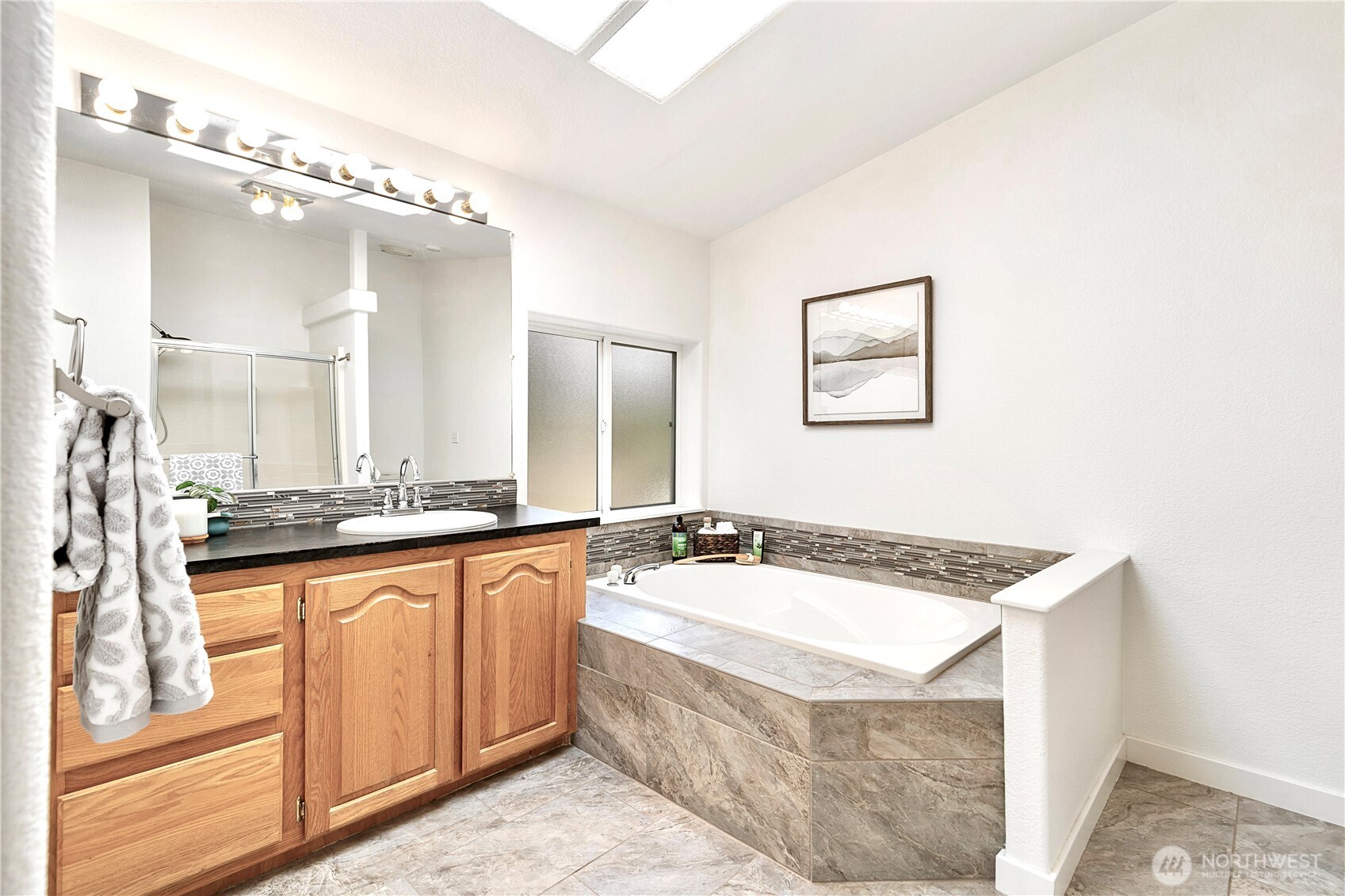 3834 South Passage View Lane Langley, WA 98260 - Photo 28 of 40 a spacious bathroom with a granite countertop sink a mirror a