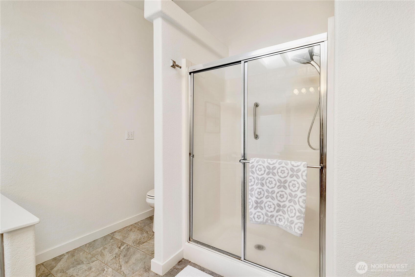 3834 South Passage View Lane Langley, WA 98260 - Photo 29 of 40 a bathroom with a glass shower door
