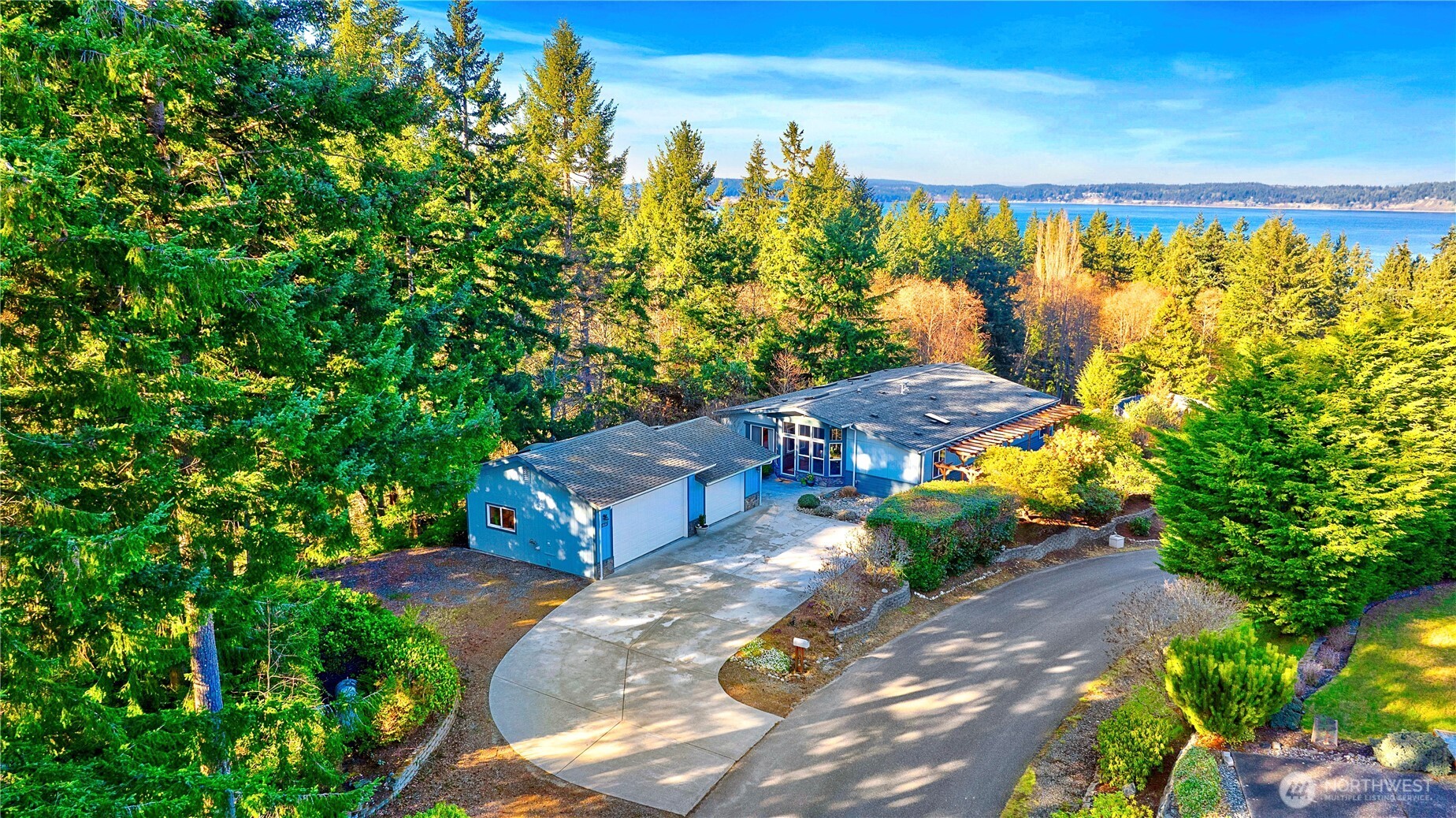 3834 South Passage View Lane Langley, WA 98260 - Photo 5 of 40 a view of a yard with plants and a fountain