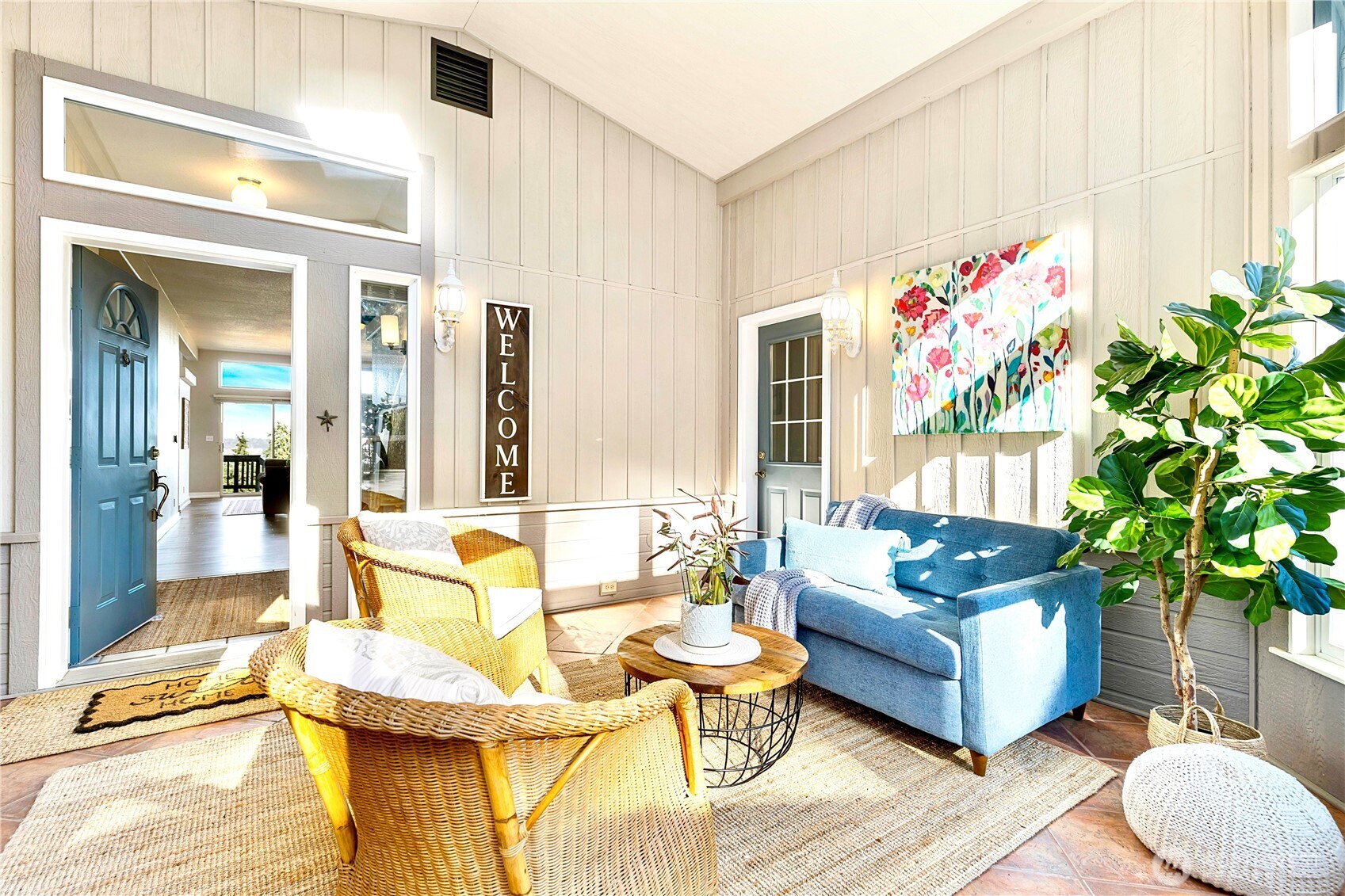 3834 South Passage View Lane Langley, WA 98260 - Photo 6 of 40 a living room with patio furniture and a potted plant