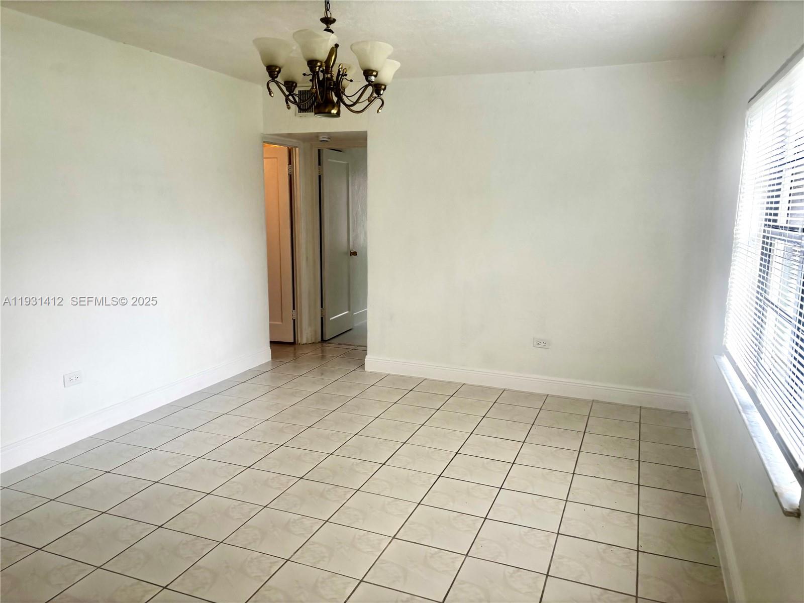 14731 Harding Lane Homestead, FL 33033 - Photo 2 of 10 a view of an empty room and window