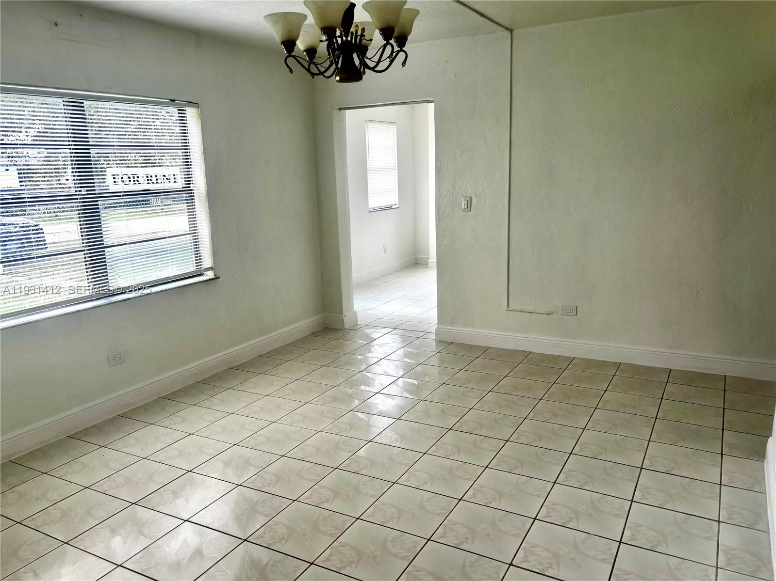 14731 Harding Lane Homestead, FL 33033 - Photo 6 of 10 a view of an empty room and window