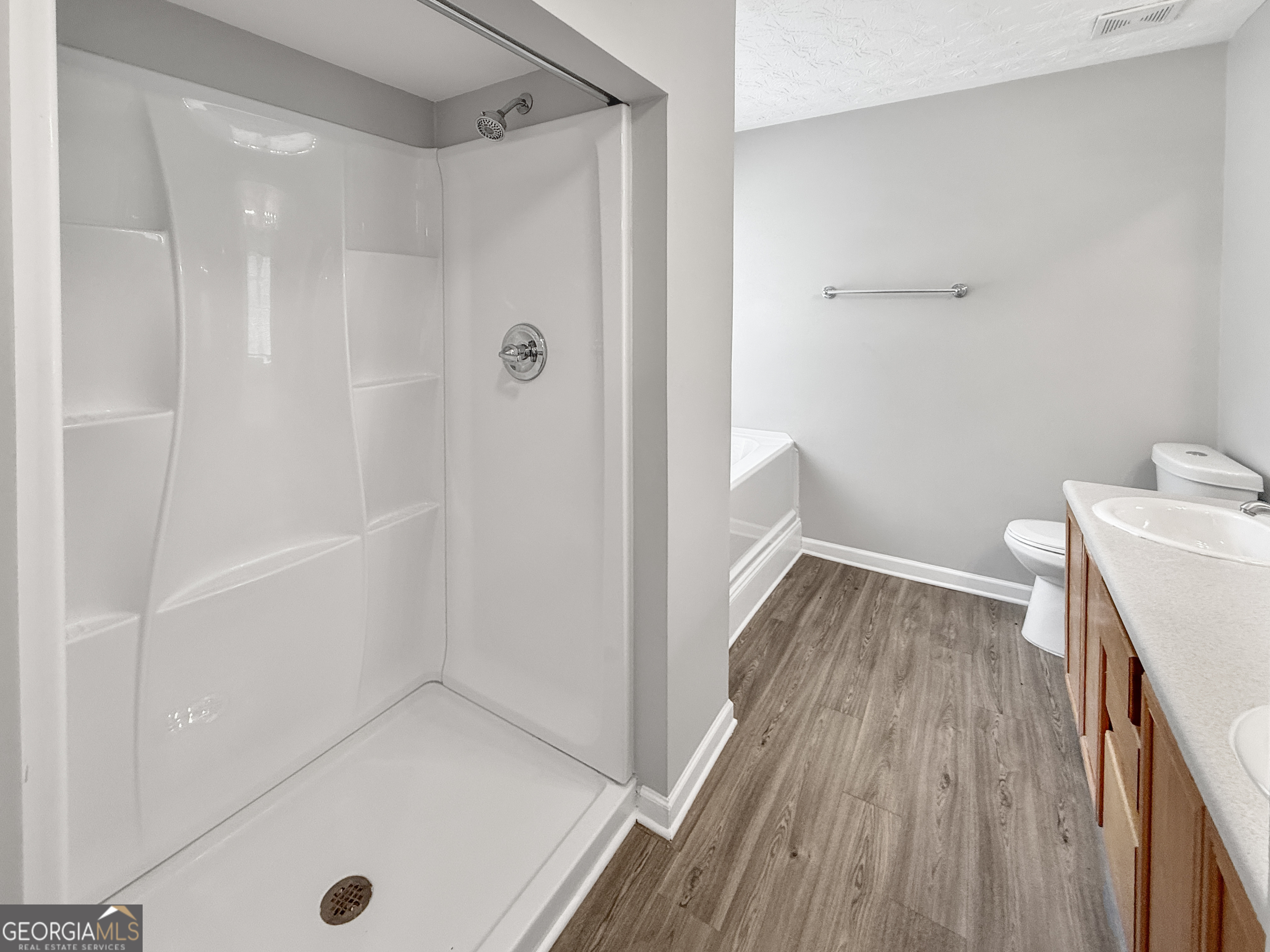 9108 South Sterling Lakes Drive Covington, GA 30014 - Photo 12 of 16 a view of a bathroom with a hardwood floor