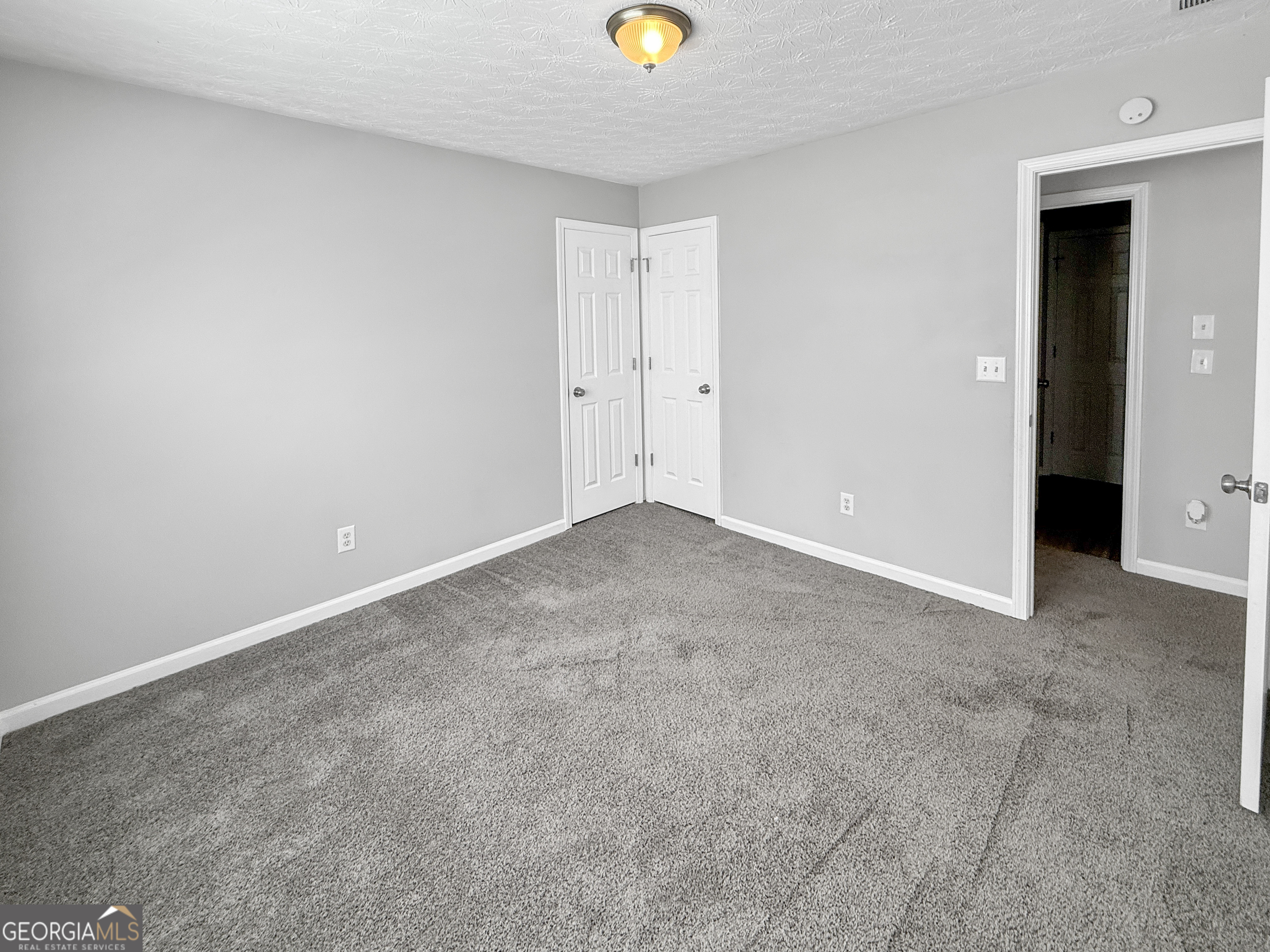 9108 South Sterling Lakes Drive Covington, GA 30014 - Photo 9 of 16 a view of an empty room