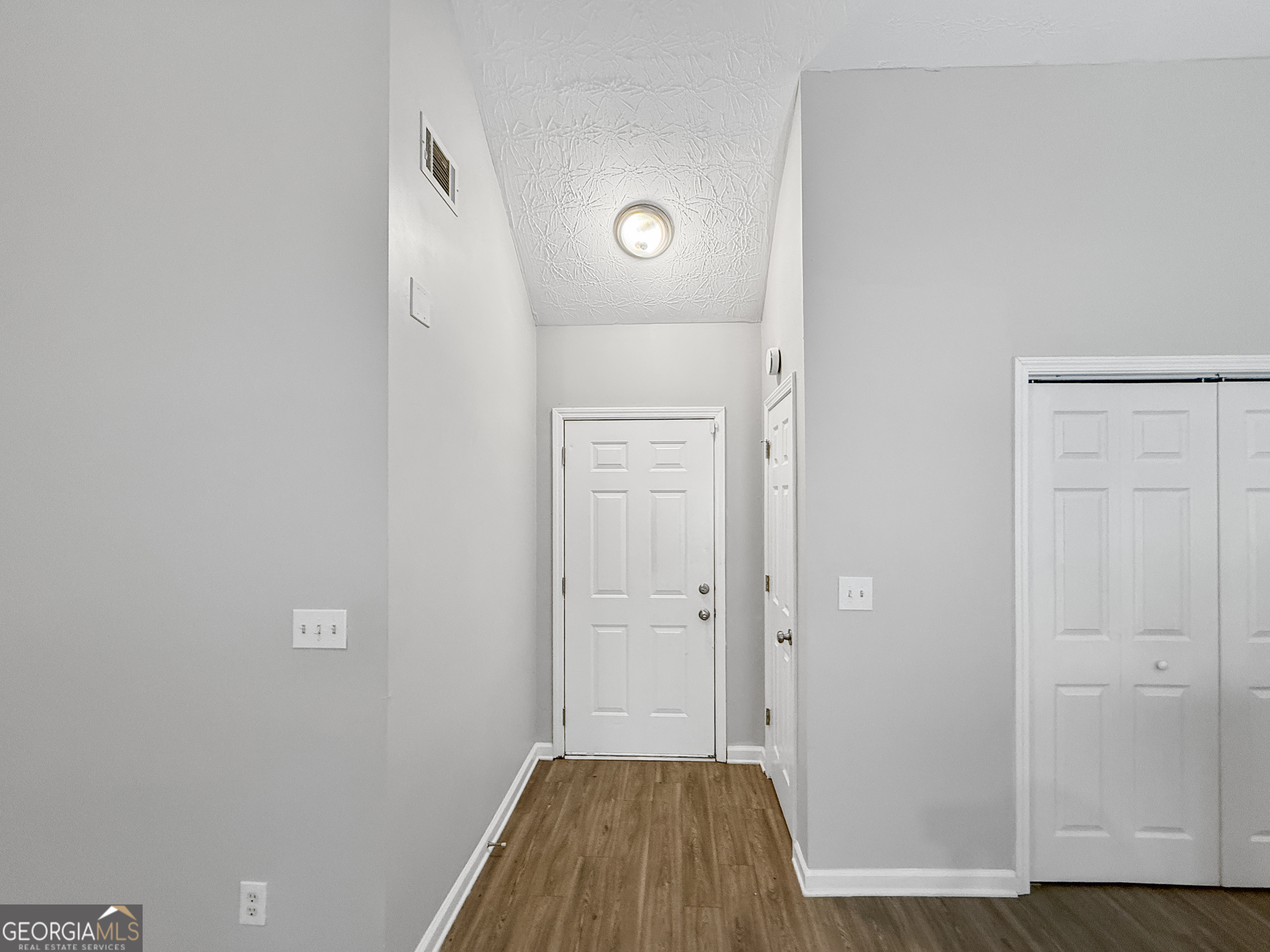 9108 South Sterling Lakes Drive Covington, GA 30014 - Photo 10 of 16 a view of a bathroom with wooden floor
