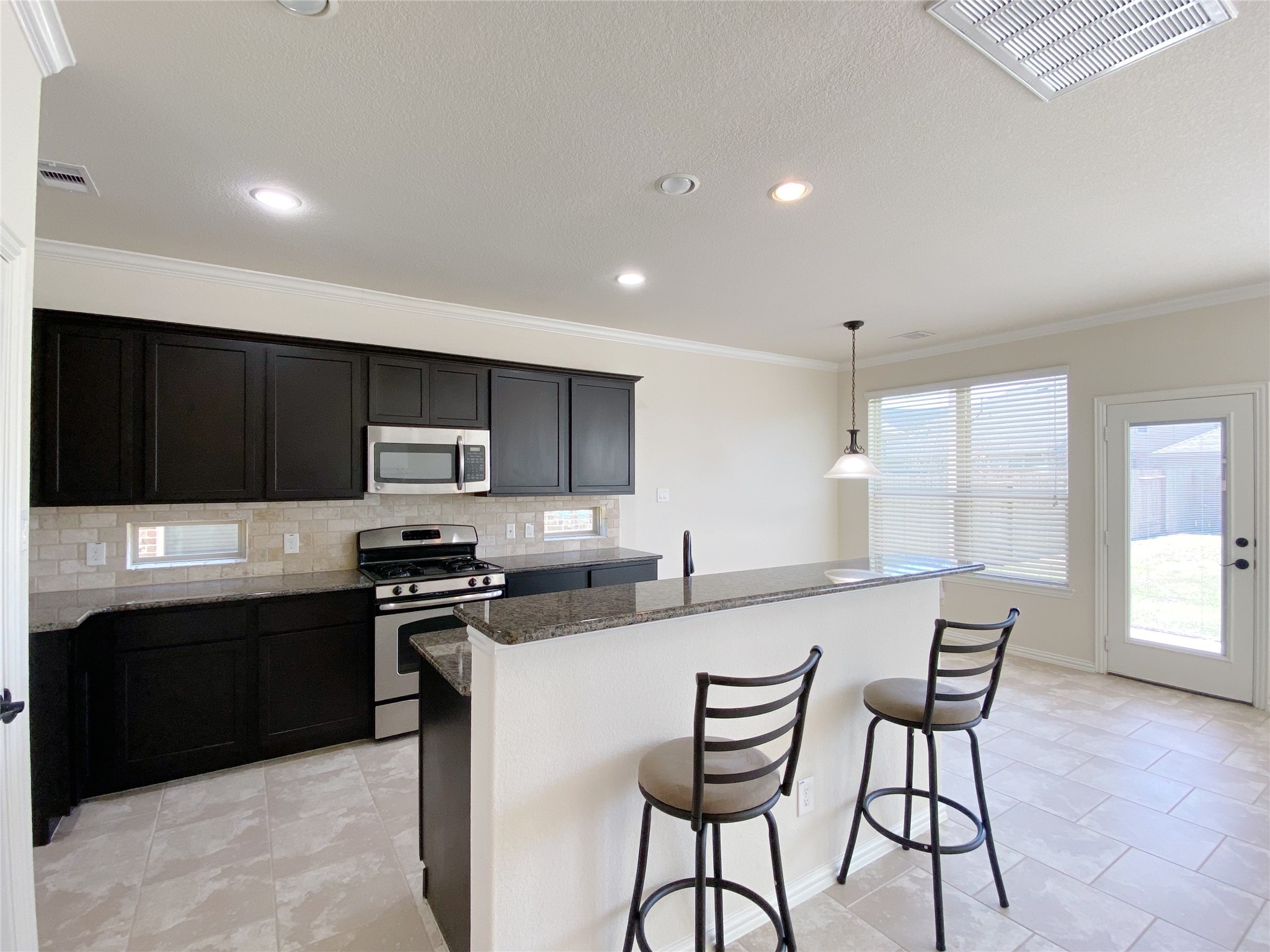 3566 Hamilton Bend Lane Spring, TX 77386 - Photo 13 of 25 a kitchen with stainless steel appliances a sink counter space and a window