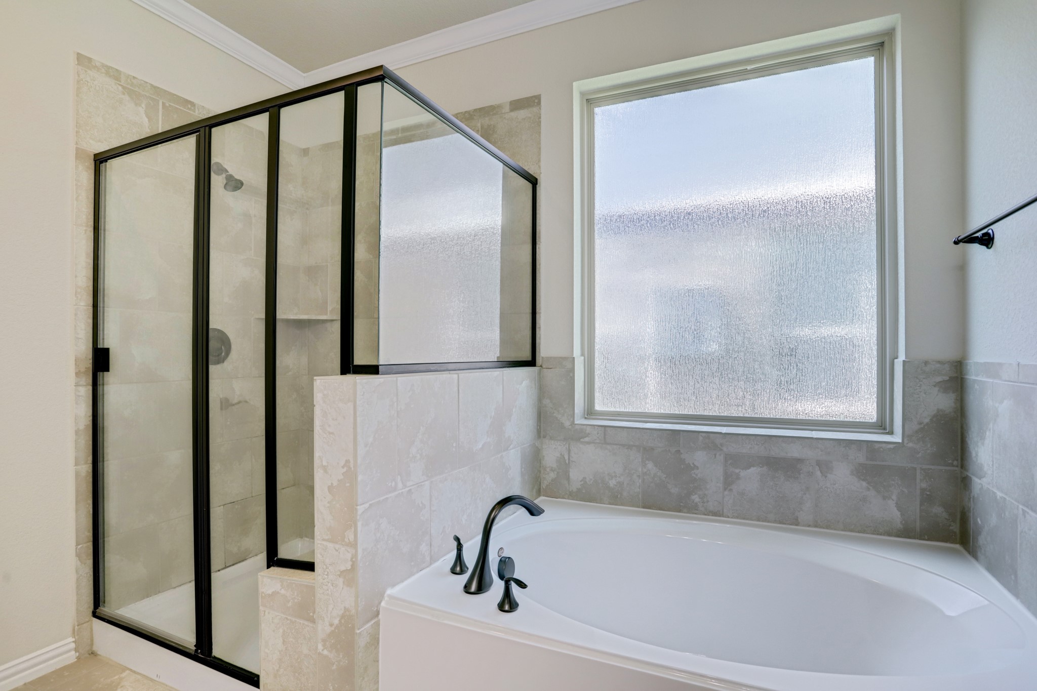 3566 Hamilton Bend Lane Spring, TX 77386 - Photo 17 of 25 a bathroom with a bathtub and a shower