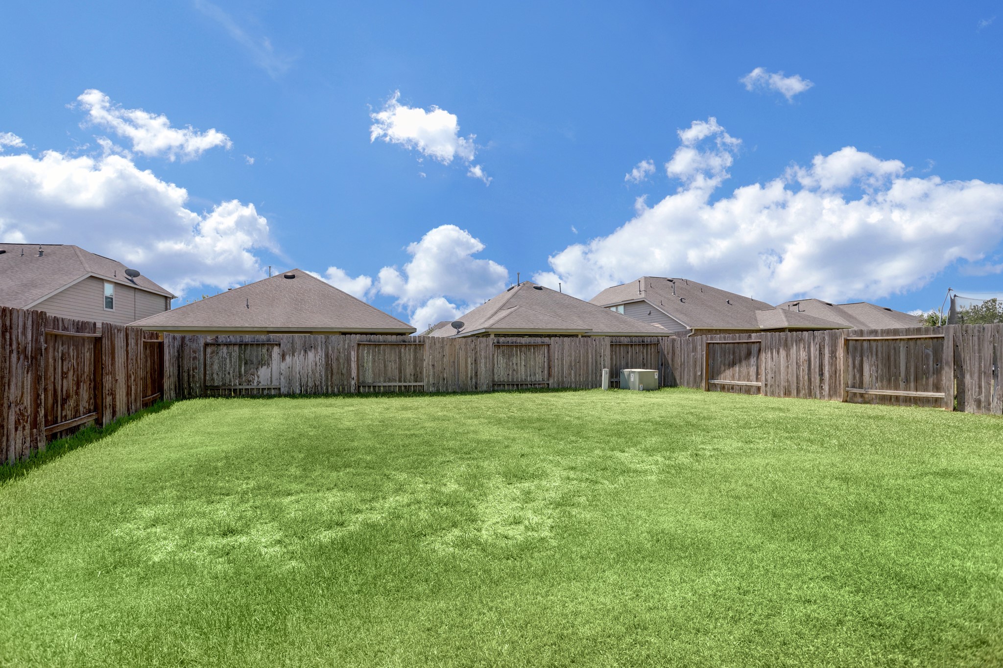 3566 Hamilton Bend Lane Spring, TX 77386 - Photo 24 of 25 a view of a house next to a yard with wooden fence