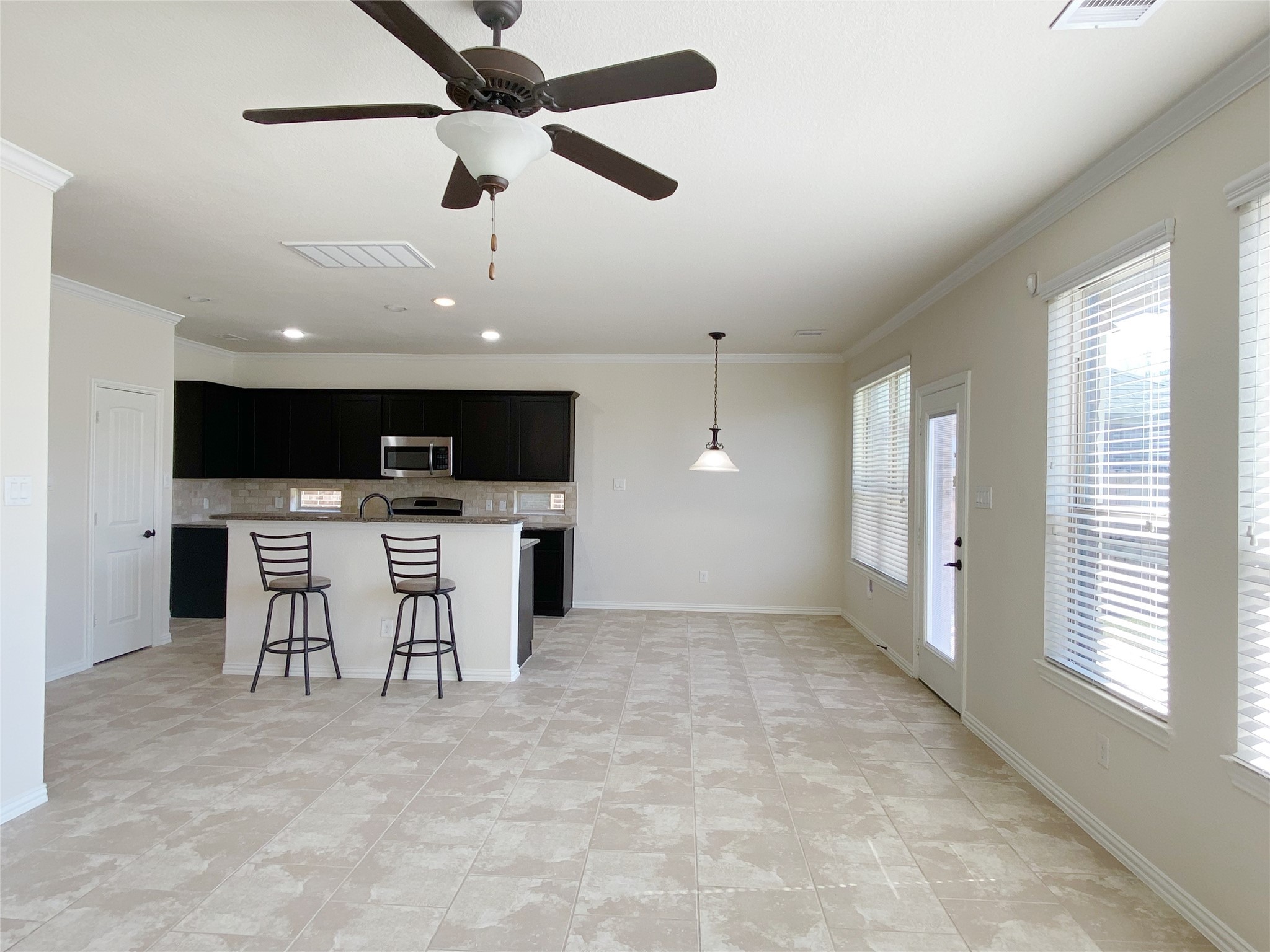 3566 Hamilton Bend Lane Spring, TX 77386 - Photo 9 of 25 a view of kitchen with stainless steel appliances kitchen island furniture and a window