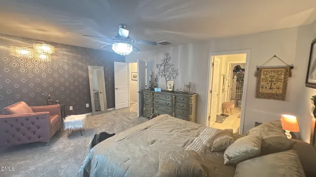 a bedroom with a bed and a couch