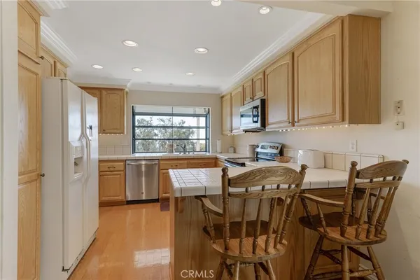 a view of a dining room with furniture and window