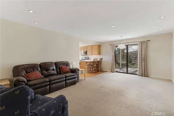 a living room with furniture and large window