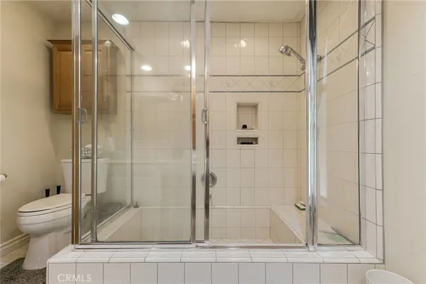 a view of hallway with cabinets
