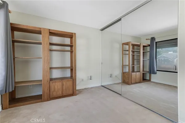 a view of a porch with a table and chairs