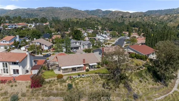 aerial view of a house with a yard