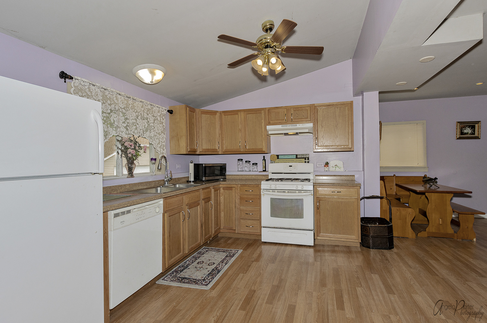 26316 West Rollins Road Ingleside, IL 60041 - Photo 2 of 45 a kitchen with a stove a sink and a refrigerator