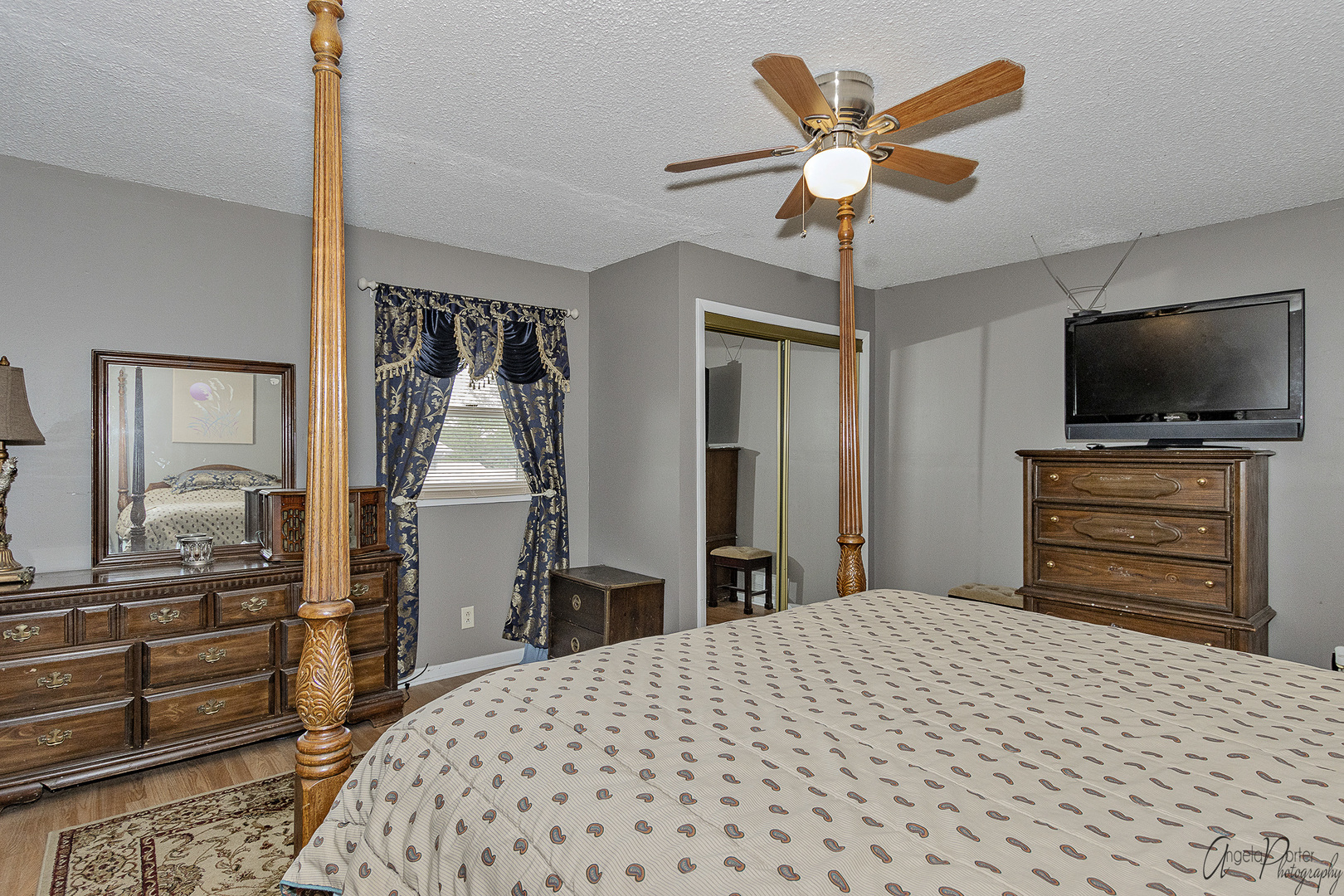 26316 West Rollins Road Ingleside, IL 60041 - Photo 20 of 45 a bedroom with a bed and a flat screen tv