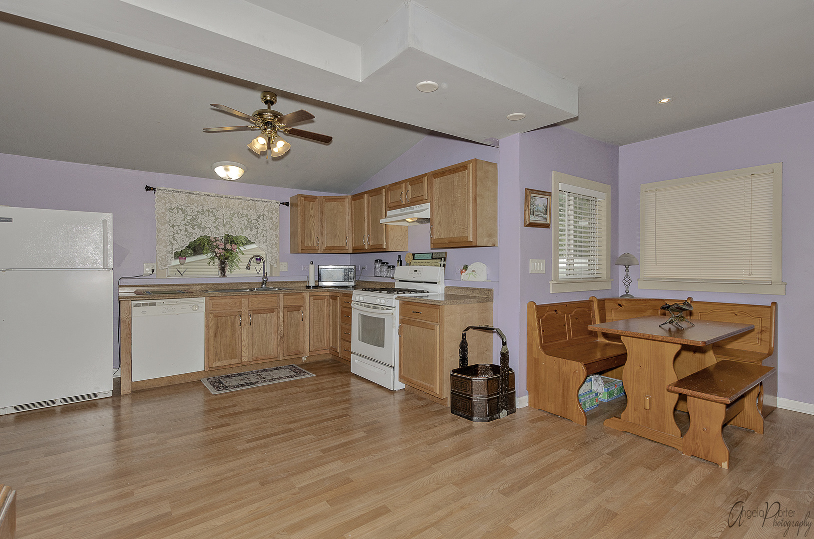 26316 West Rollins Road Ingleside, IL 60041 - Photo 4 of 45 a kitchen with a refrigerator a sink and cabinets