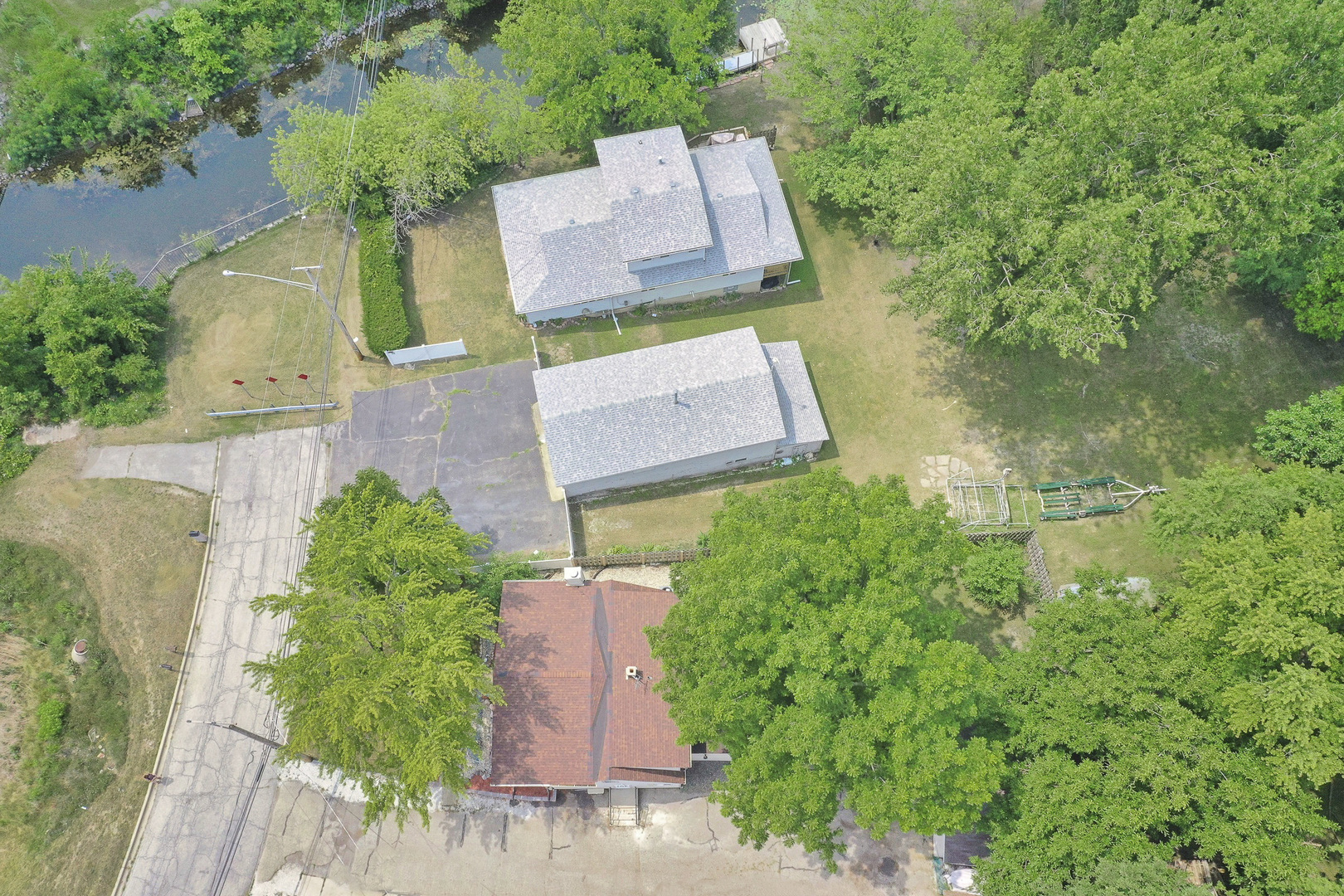 26316 West Rollins Road Ingleside, IL 60041 - Photo 38 of 45 an aerial view of a house with a yard and trees all around