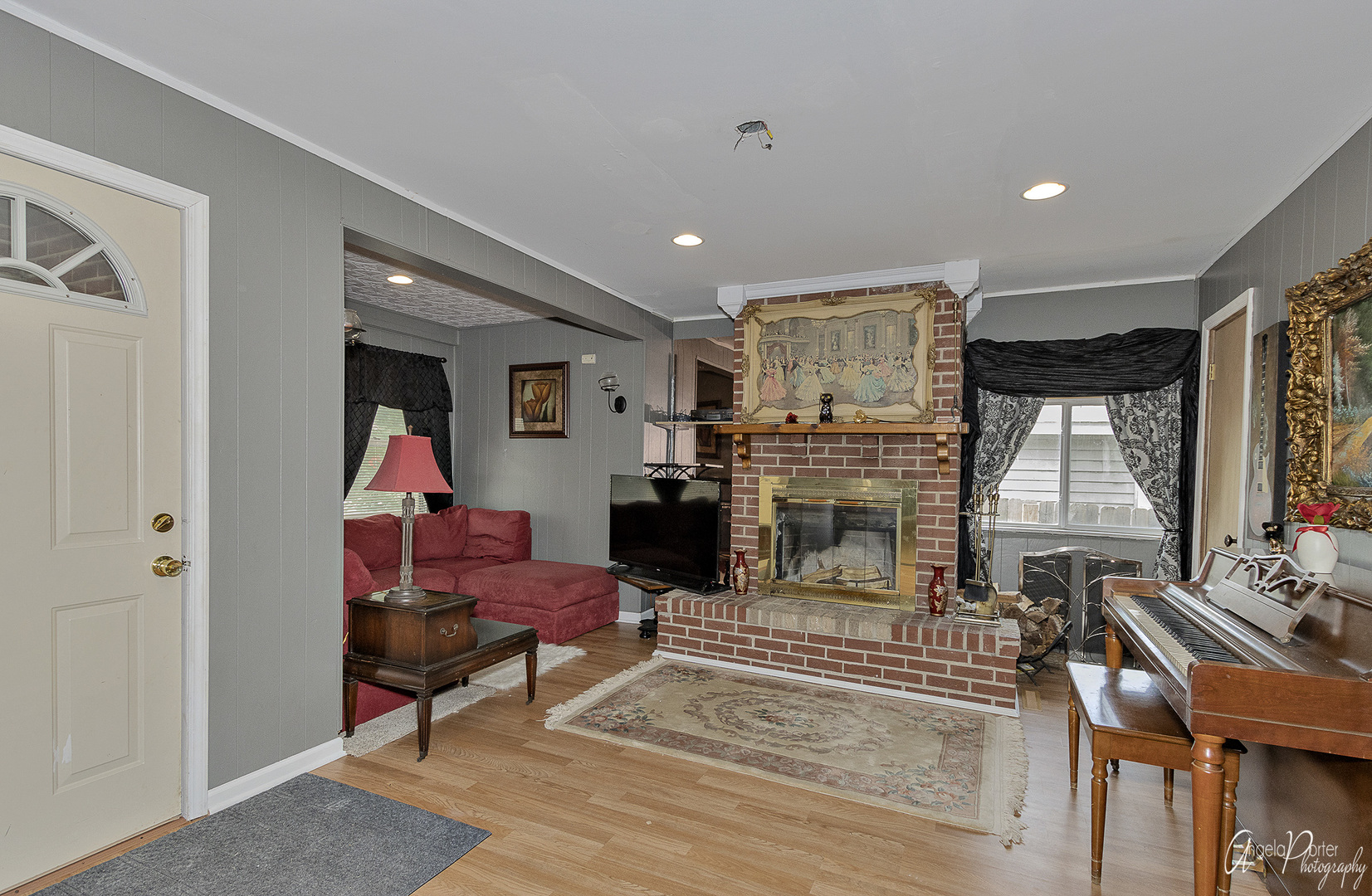 26316 West Rollins Road Ingleside, IL 60041 - Photo 10 of 45 a living room with furniture a flat screen tv and a fireplace