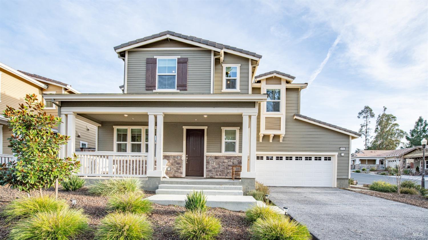 front view of a house with a yard