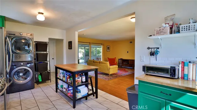 a living room with fireplace furniture and a flat screen tv