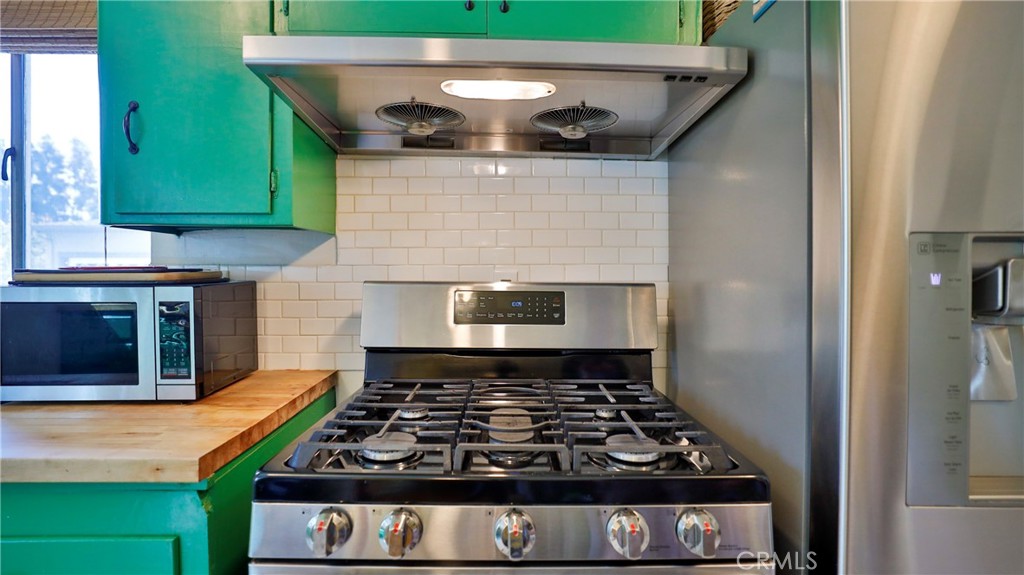 5035 Greer Avenue Covina, CA 91724 - Photo 14 of 37 a kitchen with a stove and a microwave