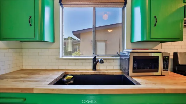 a room with pool table and a fireplace