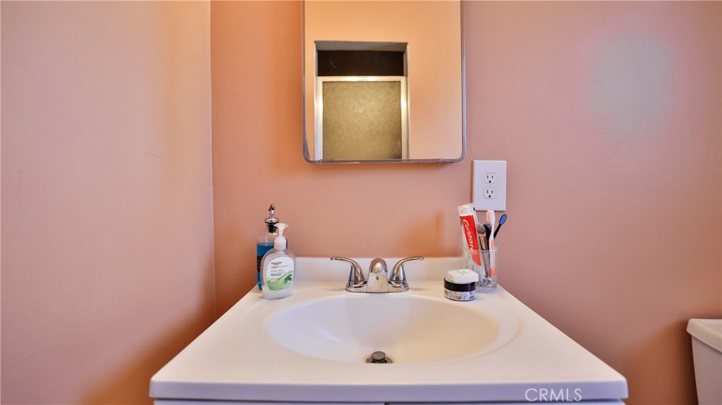 5035 Greer Avenue Covina, CA 91724 - Photo 19 of 37 a bathroom with a sink and a mirror