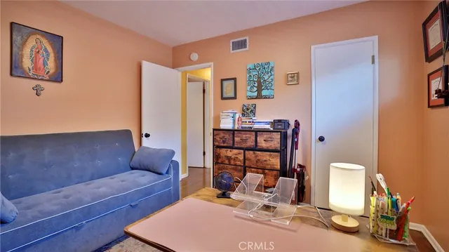 a living room with furniture a rug and a table
